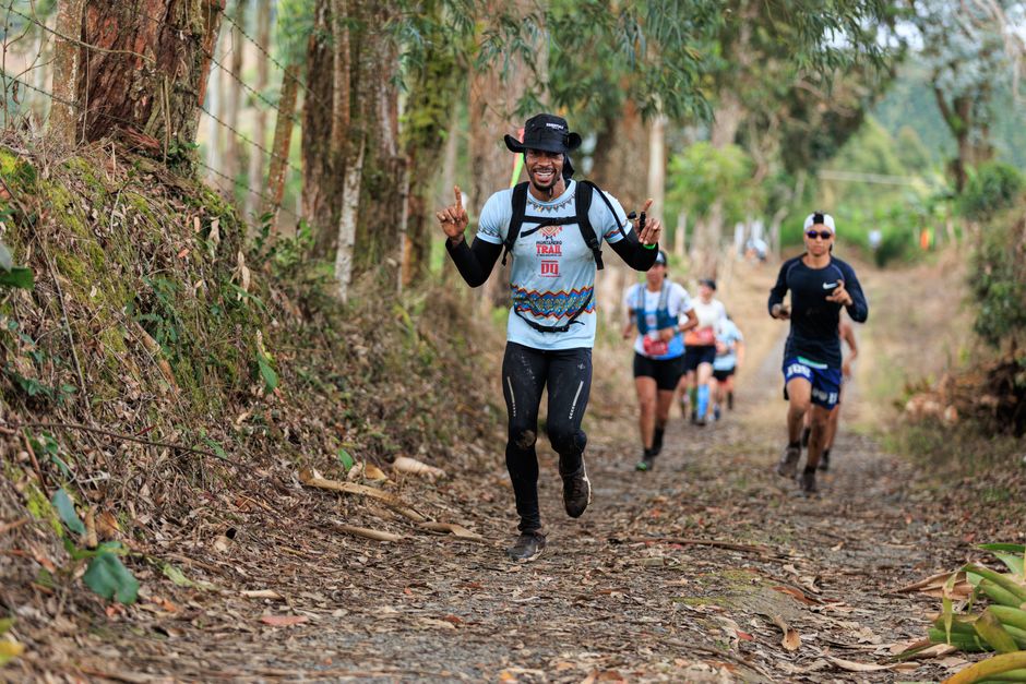 Trail runners racing through a forest path, enjoying the natural setting and camaraderie